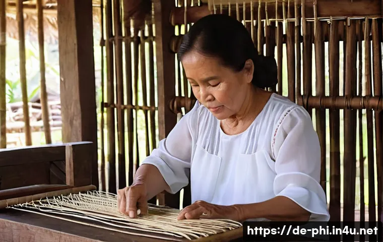 필리핀에서 필수로 사야 할 기념품 - **Philippine Pi&ntilde;a Weaving Artisan in a Traditional Workshop**
    A close-up, eye-level shot of a sk...
